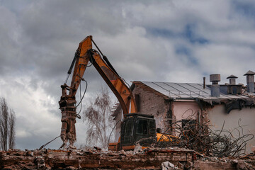 Fototapeta na wymiar Process of demolition of old industrial building