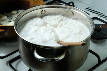 Foam from cooking chicken. Boiling water in a pan