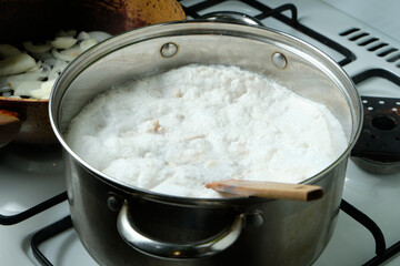 Foam from cooking chicken. Boiling water in a pan