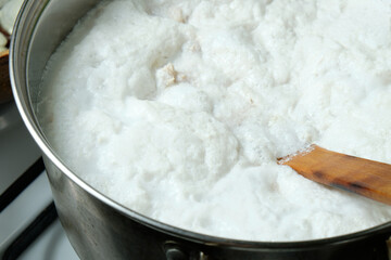 Foam from cooking chicken. Boiling water in a pan