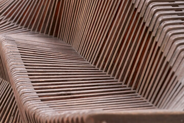 Fragment of a decorative structure made of wooden slats. Texture. Copy space.