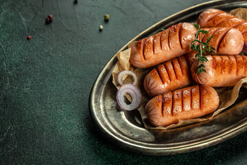 Tasty grilled sausages. Long banner format. top view. copy space for text