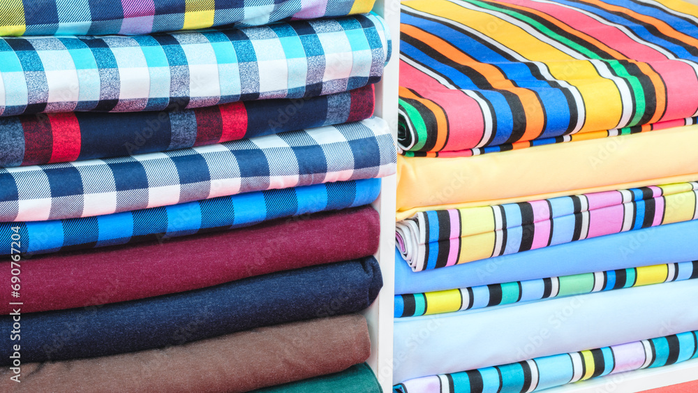 Poster multi-colored patterned fabric lies on pegs in the store