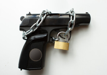 the gun, chain and closed padlock