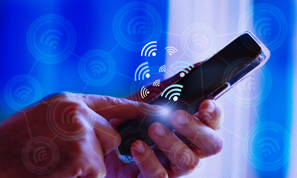 Person holding smartphone with social network icons. Business using smartphone with wifi icon. Social network concept.