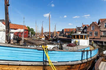 Wooden fishing boats in the old harbor of the village of Spakenburg.
