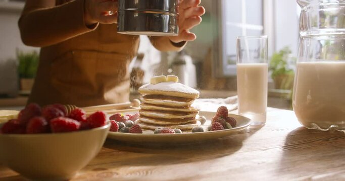 Unrecognisable chef cooking american traditional breakfast pancake on kitchen. Advertising cinematic. Art of healthy tasty food, delectable gluten-free options and recipes. Joy of weekend cooking