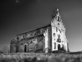 low point view to abandoned cathedral in sunny day in vintage style