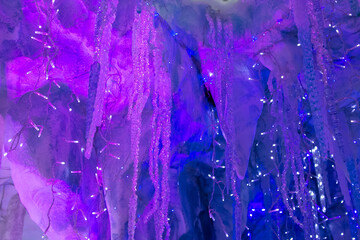 magical winter background with snow, snowflakes and soft bokeh lights on a blue sky, cold background for Christmas, snowy still life in frosty weather