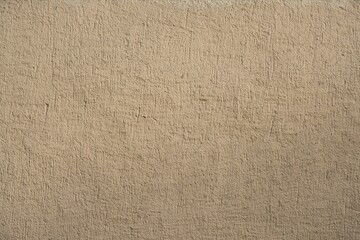 newly beige painted rough plaster