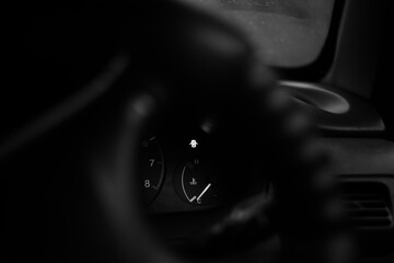 the dashboard of the car is in black and white