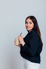 brunette woman with a cup of delicious drink with a straw