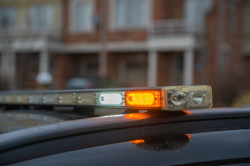 Security vehicle is stationed on the street in order to protect people and houses.