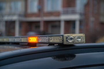 Security vehicle is stationed on the street in order to protect people and houses.