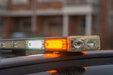 Security vehicle is stationed on the street in order to protect people and houses.
