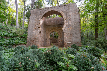 Granada, Spain; November-04, 2023: Bib-Rambla Gate among the vegetation of the forest of La Alhambra