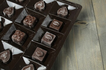 Chocolates in a box of correx on a rum background. Candy Storage Holiday Gift