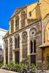 Fototapeta na wymiar Pisa, Italy - Nov. 24, 2023: Church of San Pietro in Vinculis, a Romanesque church built in the early 12th century, on Via Camillo Benso Cavour