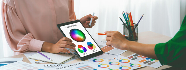 A cropped picture of professional designer selects the color by using color theory and comparing...