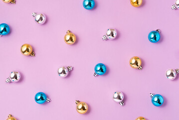 .Creative Christmas baubles decoration pattern on pink background. Minimal Christmas concept, top view