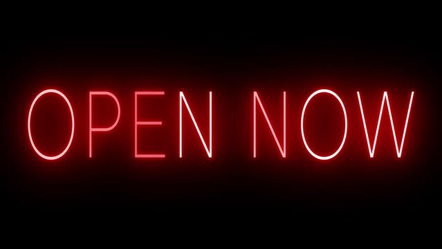 Flickering red retro style neon sign glowing against a black background for OPEN NOW