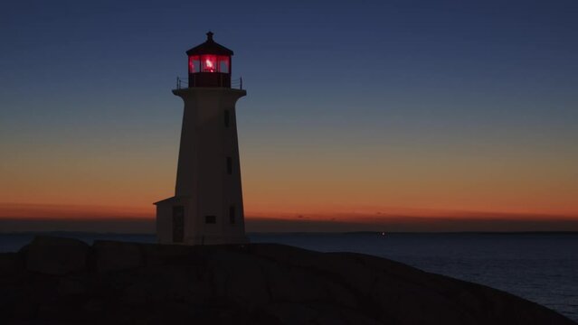 Peggy's Cove Lighthouse at dusk Atlantic Coast Halifax Nova Scotia Canada.