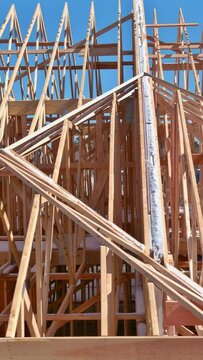 As part construction of new home wooden beam stick frames were constructed from truss beams