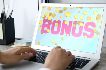 Bonus gaining. Woman using laptop at table, closeup. Illustration of falling coins and word on device screen