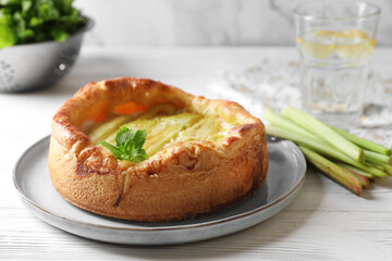 Freshly baked rhubarb pie on white wooden table