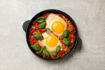 Delicious Shakshuka on light grey table, top view