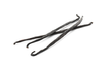 Many aromatic vanilla pods isolated on white