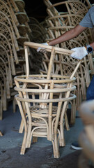 a worker stacking rattan products