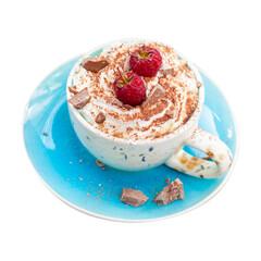 A beautiful blue cup of coffee with whipped cream, cocoa powder and raspberries on rustic wooden background