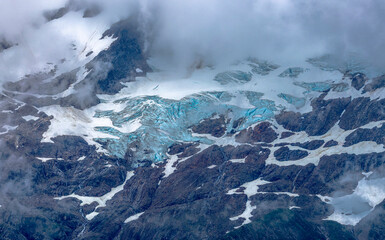 Mountain Top with Ice, Snow and Clouds - Alaska
