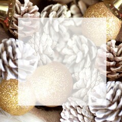 Photo of Christmas tree ornaments of pine cones and gold balls. This image is perfect as a background for Christmas party invitations or gift cards. Also on SNS