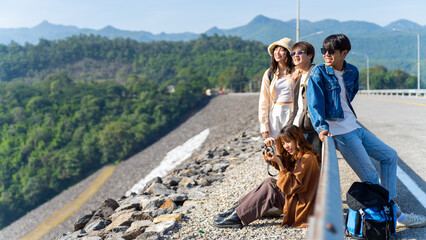 Group of Asian generation z people friends looking beautiful nature of countryside forest and...