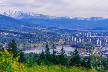 Fototapeta na wymiar Aerial view of Burrard Inlet at Port Moody, BC, with spectacular mountain backdrop.