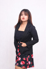 Beautiful Asian Indonesian girl in a casual professional office elegant skirt with her right hand...