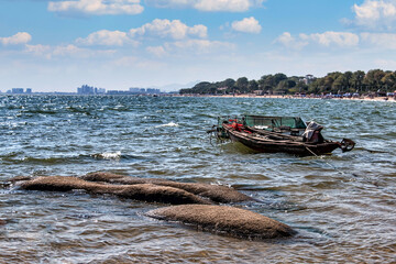 An old fishing boat on the seashore