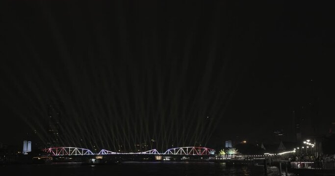 Light and firework show over the old steel bridge ,Phra Phuttha Yodfa Bridge at Bangkok, Thailand Theme Vijit Chao Phraya 2023 Bangkok Thailand