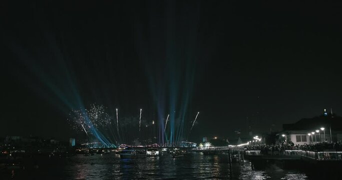 Light and firework show over the old steel bridge ,Phra Phuttha Yodfa Bridge at Bangkok, Thailand Theme Vijit Chao Phraya 2023 Bangkok Thailand