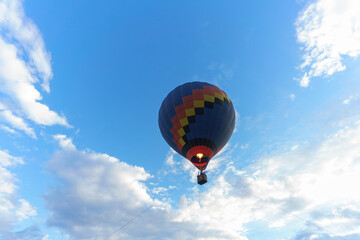 A hot air balloon over the blue sky.