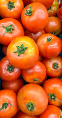 Group of tomatoes lying on a pile on top of each other, tomato texture. Selective focus, for content creation