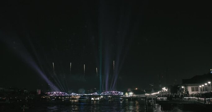 Light and firework show over the old steel bridge ,Phra Phuttha Yodfa Bridge at Bangkok, Thailand Theme Vijit Chao Phraya 2023 Bangkok Thailand