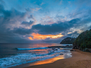 Fototapeta na wymiar Northern Beaches Sunrise at the seaside with rain clouds