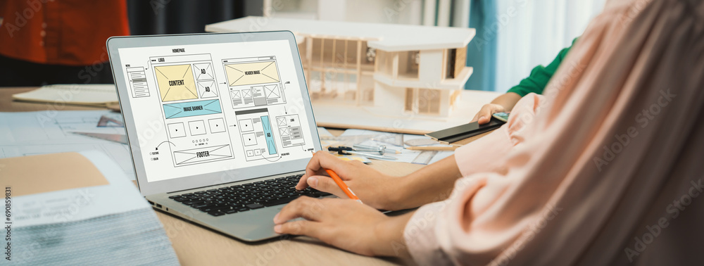 Poster cropped image of interior designer team discuss the material color while laptop displayed website wi