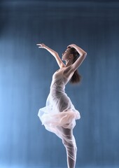 woman white dress dancing studio floats midair body features face floating particles wind blowing leaves trance anorexic figure dancers - obrazy, fototapety, plakaty