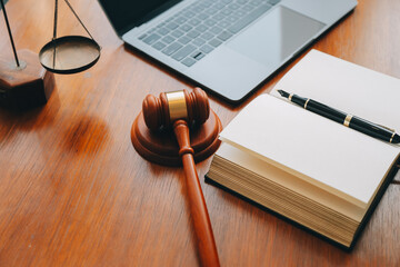 Business and lawyers discussing contract papers with brass scale on desk in office. Law, legal...