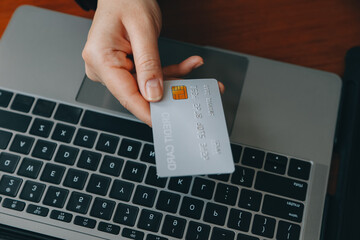 Women holding credit card and using smartphones at home.Online shopping, internet banking, store...