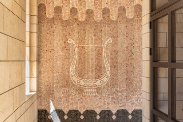 Decorative mosaic depicting a harp on the wall of the Church of the Annunciation in the Nazareth...
